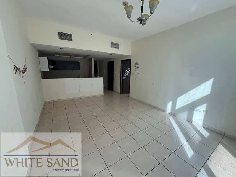 DISTRESS SALE — Royal Residence 2 — Pool & City View — Unfurnished — Dubai Sports City distress deal
